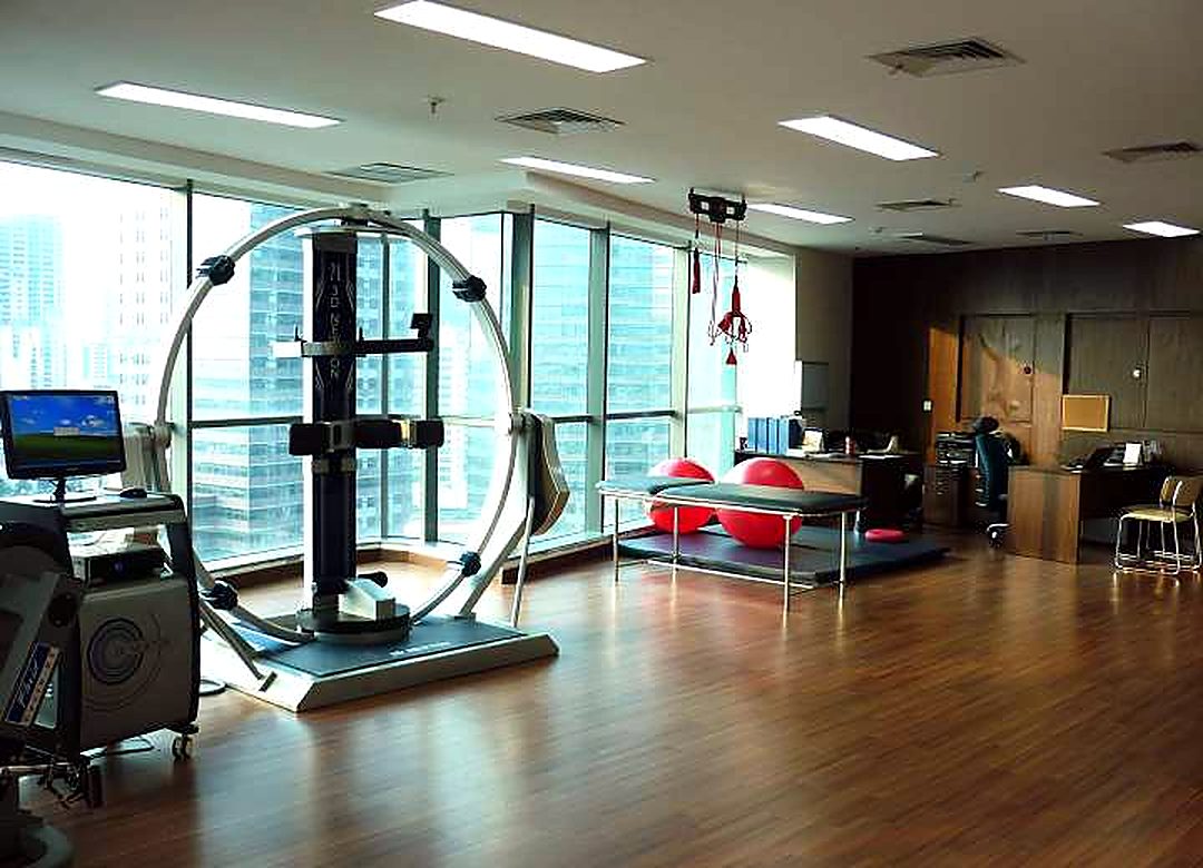 Exercise treatment room with a 3D training frame and a view over Jakarta